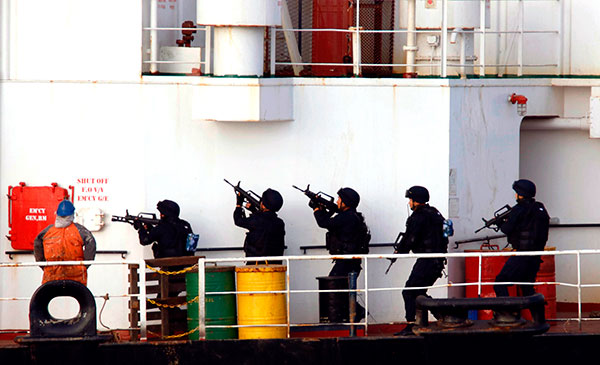 Members of the People's Liberation Army Navy rescue a Tuvalu-flagged cargo ship from pirates on April 9 in the Gulf of Aden. On Saturday, the PLA Navy rescued another vessel threatened by pirates, sending a helicopter to run the marauders off. The ship continued on its way. Niu Yunhai / China News Service Members of the People's Liberation Army Navy rescue a Tuvalu-flagged cargo ship from pirates on April 9 in the Gulf of Aden. On Saturday, the PLA Navy rescued another vessel threatened by pirates, sending a helicopter to run the marauders off. The ship continued on its way. Niu Yunhai / China News Service
