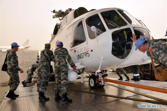 Chinese soldiers help to unload a military helicopter from an aerotransport at Khartoum airport on June 11, 2017. China's first helicopter unit on Sunday arrived in Sudanese capital Khartoum to join the United Nations African Union Mission in Darfur (UNAMID). (Xinhua/Li Ziheng) Chinese soldiers help to unload a military helicopter from an aerotransport at Khartoum airport on June 11, 2017. China's first helicopter unit on Sunday arrived in Sudanese capital Khartoum to join the United Nations African Union Mission in Darfur (UNAMID). (Xinhua/Li Ziheng)