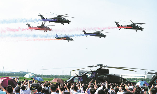 The Fenglei aerobatics team of the PLA Ground Force performs at the fourth China Helicopter Expo opening ceremony on Thursday in Tianjin. More than 400 helicopters from 22 countries and regions are on display at the expo. JIA LEI / FOR CHINA DAILY The AV500W unmanned autonomous helicopter is on display at the fourth China Helicopter Expo in Tianjin. ZHAO LEI / CHINA DAILY