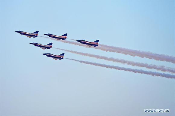 J-10 aerobatic fighter jets of the Chinese Air Force's August 1st Air Demonstration Team perform on the opening day of the Dubai Airshow 2017 in Dubai, the United Arab Emirates, on Nov. 12, 2017.  (Xinhua/Zhao Dingzhe)