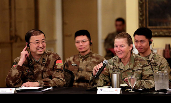 Major General Li Hui (left) of the Political Work Department of the Central Military Commission talks with US Army Major General Susan Davidson at a seminar, part of a joint humanitarian and disaster relief exercise in Portland, Oregon, on Monday. (YIN HANG/FOR CHINA DAILY) Major General Li Hui (left) of the Political Work Department of the Central Military Commission talks with US Army Major General Susan Davidson at a seminar, part of a joint humanitarian and disaster relief exercise in Portland, Oregon, on Monday. (YIN HANG/FOR CHINA DAILY)