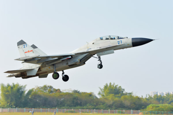A fighter jet of the Navy's South Sea Fleet takes off from an unidentified air base this month to take part in a recent combat exercise over the western Pacific Ocean. (Photo by GAO HONGWEI/FOR CHINA DAILY) A fighter jet of the Navy's South Sea Fleet takes off from an unidentified air base this month to take part in a recent combat exercise over the western Pacific Ocean. (Photo by GAO HONGWEI/FOR CHINA DAILY)