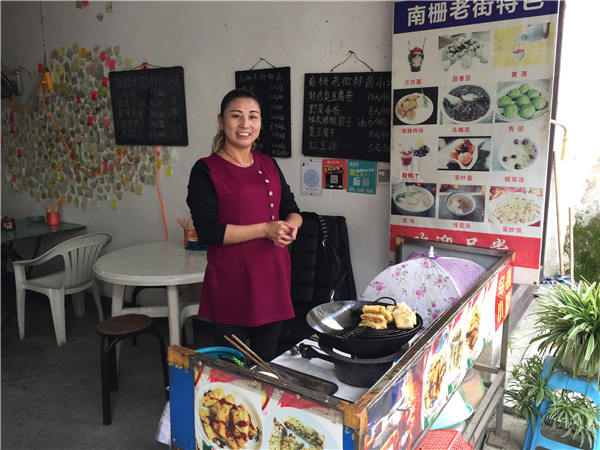 Wu Dongyun sells stinky-tofu rolls and other local food at a small diner in Nanzha. Wu Dongyun sells stinky-tofu rolls and other local food at a small diner in Nanzha.