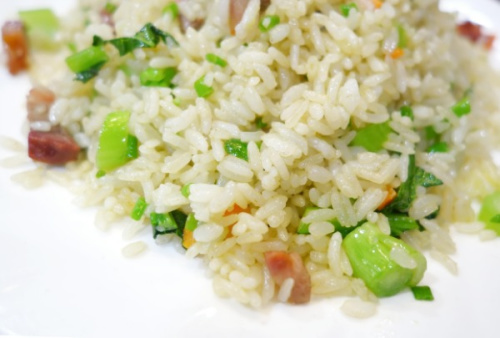 Fried rice with mustard greens and salty cured meats. (Photo Provided to China Daily) Fried rice with mustard greens and salty cured meats. (Photo Provided to China Daily)