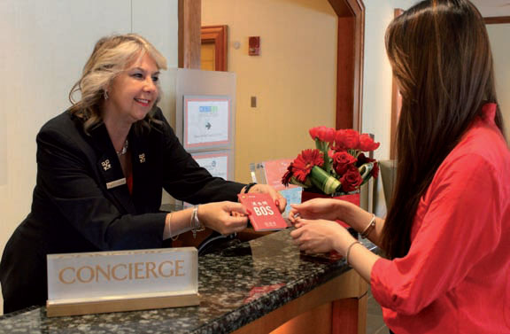 Betty Salemme, chief concierge of The Seaport Hotel, hands a customer a new Chinese-language map of Boston put together by Attract China. Boston is seeing an increasing number of Chinese travelers. (Photo provided to China Daily) Betty Salemme, chief concierge of The Seaport Hotel, hands a customer a new Chinese-language map of Boston put together by Attract China. Boston is seeing an increasing number of Chinese travelers. (Photo provided to China Daily)