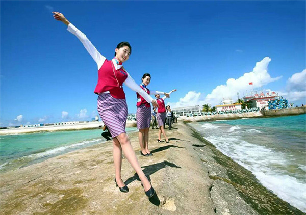 Stewardesses celebrate after China successfully carried out test flights of two commercial airliners on Jan 6 at a newly built airport at Yongshu Jiao in China's Nansha Islands. (Photo/Xinhua) Stewardesses celebrate after China successfully carried out test flights of two commercial airliners on Jan 6 at a newly built airport at Yongshu Jiao in China's Nansha Islands. (Photo/Xinhua)