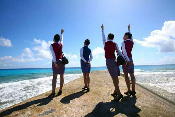 Stewardesses celebrate. (Photo/Xinhua) Stewardesses celebrate. (Photo/Xinhua)