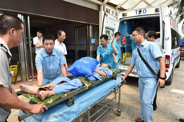 Three patients, who are workers on Yongshu Reef in the South China Sea, arrive at Phoenix International Airport in Sanya, south China’s Hainan Province on Sunday. The three emergency patients, who were suffering from gastrointestinal bleeding, a lumbar fracture and appendicitis, respectively, had to be flown by a navy jet to a hospital in Sanya due to a lack of medical facilities to treat their conditions on the reef. (Photo/Xinhua) Three patients, who are workers on Yongshu Reef in the South China Sea, arrive at Phoenix International Airport in Sanya, south China’s Hainan Province on Sunday. The three emergency patients, who were suffering from gastrointestinal bleeding, a lumbar fracture and appendicitis, respectively, had to be flown by a navy jet to a hospital in Sanya due to a lack of medical facilities to treat their conditions on the reef. (Photo/Xinhua)