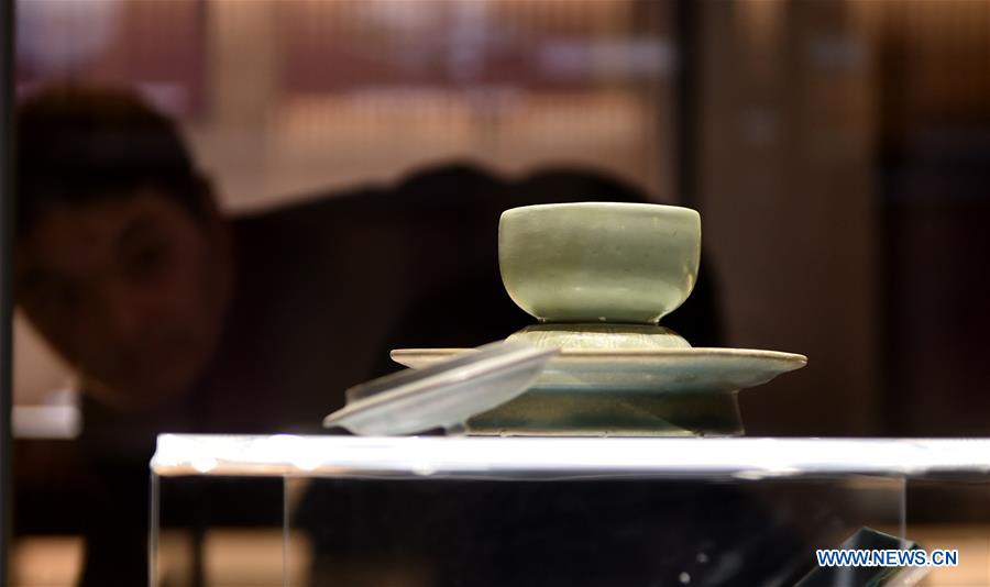 Visitors view exhibits at Qingliang temple Ru kiln museum