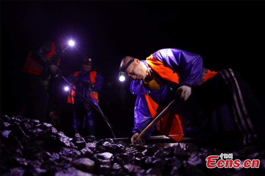 Railway workers brave rain for night upgrades
