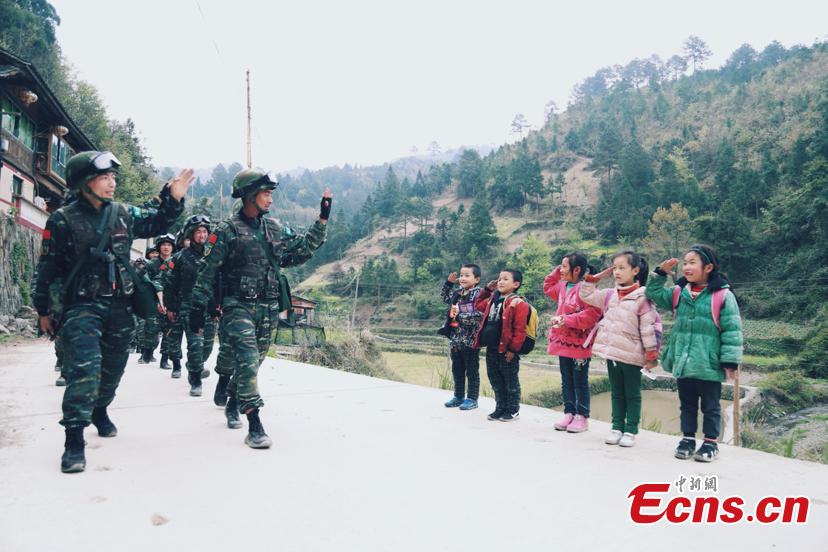 Children's salute to armed police