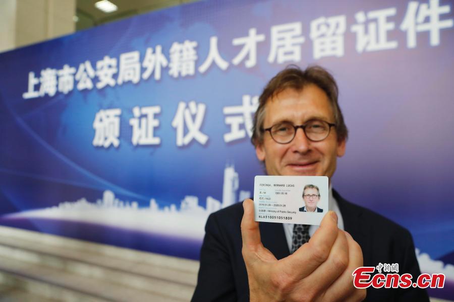 Shanghai issues green cards to seven foreigners