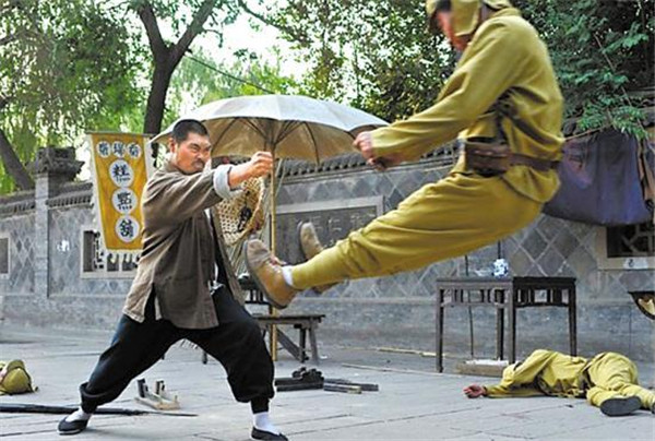 A scene from a TV series that shows a Chinese man repelling a Japanese soldier with his fist. (Photo/CRI) A scene from a TV series that shows a Chinese man repelling a Japanese soldier with his fist. (Photo/CRI)