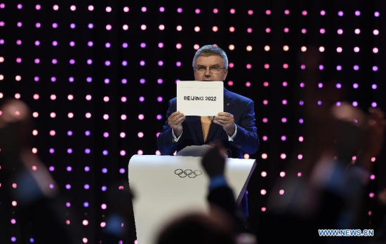 President of the International Olympic Committee (IOC) Thomas Bach announces that Beijing won the bid to host the 2022 Olympic Winter Games at the 128th International Olympic Committee session in Kuala Lumpur, Malaysia, July 31, 2015.(Xinhua/Gong Lei) President of the International Olympic Committee (IOC) Thomas Bach announces that Beijing won the bid to host the 2022 Olympic Winter Games at the 128th International Olympic Committee session in Kuala Lumpur, Malaysia, July 31, 2015.(Xinhua/Gong Lei)