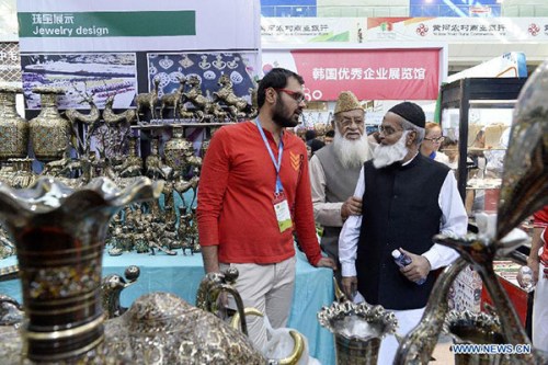 People select Pakistani brassware at the China-Arab States Expo 2015 in Yinchuan, capital of northwest China's Ningxia Hui Autonomous Region, Sept 12, 2015. (Photo/Xinhua) People select Pakistani brassware at the China-Arab States Expo 2015 in Yinchuan, capital of northwest China's Ningxia Hui Autonomous Region, Sept 12, 2015. (Photo/Xinhua)