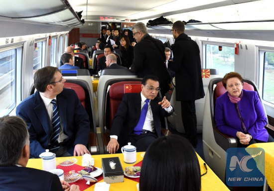 Chinese Premier Li Keqiang (2nd L, 2nd row) invites leaders attending the fourth China and Central and Eastern European (CEE) countries leaders' meeting to a ride on a China-made bullet train from Suzhou to Shanghai, Nov. 25, 2015. (Photo: Xinhua/Rao Aimin) Chinese Premier Li Keqiang (2nd L, 2nd row) invites leaders attending the fourth China and Central and Eastern European (CEE) countries leaders' meeting to a ride on a China-made bullet train from Suzhou to Shanghai, Nov. 25, 2015. (Photo: Xinhua/Rao Aimin)
