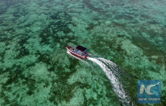 A boat moves on the sea near Zhaoshu Island of Qilianyu Islands in Sansha City, south China's Hainan Province, April 30, 2016. (Xinhua/Yang Guanyu) A boat moves on the sea near Zhaoshu Island of Qilianyu Islands in Sansha City, south China's Hainan Province, April 30, 2016. (Xinhua/Yang Guanyu)
