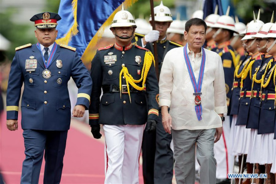 Philippine President Rodrigo Duterte (3rd L), accompanied by Philippine National Police Chief Ronald dela Rosa (1st L), during Ronald dela Rosa's assumption of command ceremony in Quezon City July 1, 2016. (Xinhua/Rouelle Umali) Philippine President Rodrigo Duterte (3rd L), accompanied by Philippine National Police Chief Ronald dela Rosa (1st L), during Ronald dela Rosa's assumption of command ceremony in Quezon City July 1, 2016. (Xinhua/Rouelle Umali)