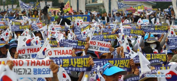 People from Seongju county hold the national flags of South Korea and banners to protest against the deployment of the Terminal High Altitude Area Defense (THAAD), during a rally in Seoul, capital of South Korea, on July 21, 2016. (Xinhua/Yao Qilin) People from Seongju county hold the national flags of South Korea and banners to protest against the deployment of the Terminal High Altitude Area Defense (THAAD), during a rally in Seoul, capital of South Korea, on July 21, 2016. (Xinhua/Yao Qilin)