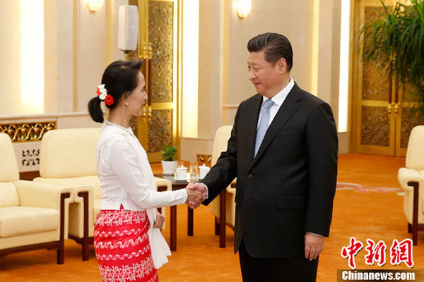 Chinese President Xi Jinping (R) meets with a delegation from Myanmar's National League for Democracy (NLD), headed by NLD chair Aung San Suu Kyi, at the Great Hall of the People in Beijing, China, June 11, 2015. (CNS photo/Sheng Jiapeng) Chinese President Xi Jinping (R) meets with a delegation from Myanmar's National League for Democracy (NLD), headed by NLD chair Aung San Suu Kyi, at the Great Hall of the People in Beijing, China, June 11, 2015. (CNS photo/Sheng Jiapeng)