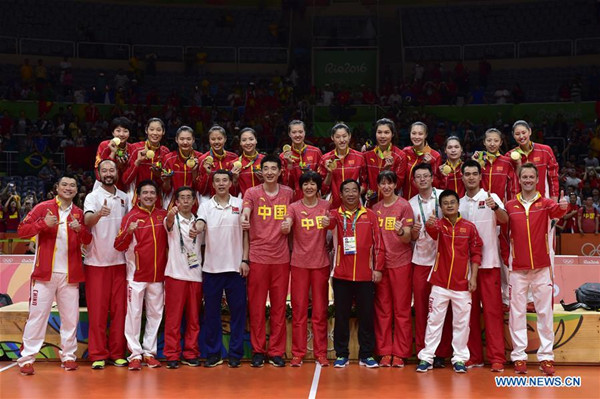 Members of China's women volleyball team pose for photos after the awarding ceremony for the women's final of Volleyball at the 2016 Rio Olympic Games in Rio de Janeiro, Brazil, on Aug. 20, 2016. China won the gold medal. (Xinhua/Yue Yuewei) Members of China's women volleyball team pose for photos after the awarding ceremony for the women's final of Volleyball at the 2016 Rio Olympic Games in Rio de Janeiro, Brazil, on Aug. 20, 2016. China won the gold medal. (Xinhua/Yue Yuewei)