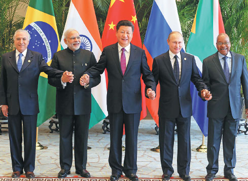 President Xi Jinping (center) takes a group photo with Indian Prime Minister Narendra Modi (2nd left), Brazilian President Michel Temer (left), Russian President Vladimir Putin (2nd right) and South African President Jacob Zuma (right) ahead of the G20 Summit in Hangzhou, Zhejiang, on Sunday. (Photo by Xu Jingxing / China Daily) President Xi Jinping (center) takes a group photo with Indian Prime Minister Narendra Modi (2nd left), Brazilian President Michel Temer (left), Russian President Vladimir Putin (2nd right) and South African President Jacob Zuma (right) ahead of the G20 Summit in Hangzhou, Zhejiang, on Sunday. (Photo by Xu Jingxing / China Daily)
