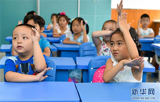 Students raising their hands in class. (File photo/Xinhua) Students raising their hands in class. (File photo/Xinhua)