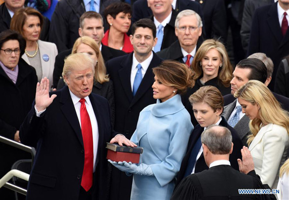 U.S. President Donald Trump(L) takes the oath of office during the presidential inauguration ceremony at the U.S. Capitol in Washington D.C., the United States, on Jan. 20, 2017. Donald Trump was sworn in on Friday as the 45th President of the United States. (Xinhua/Yin Bogu) U.S. President Donald Trump(L) takes the oath of office during the presidential inauguration ceremony at the U.S. Capitol in Washington D.C., the United States, on Jan. 20, 2017. Donald Trump was sworn in on Friday as the 45th President of the United States. (Xinhua/Yin Bogu)