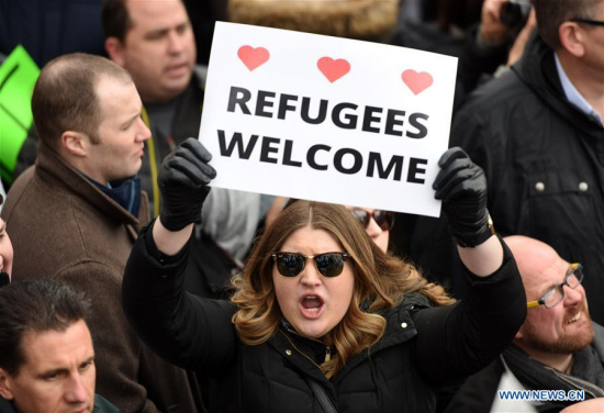 Demonstrators participate in a protest against U.S. President Donald Trump's executive order temporarily barring all refugees and seven Mideast and North African countries' citizens from entry into the U.S. in front of the White House in Washington D.C., the Unite States, on Jan. 29, 2017. (Xinhua/Yin Bogu) Demonstrators participate in a protest against U.S. President Donald Trump's executive order temporarily barring all refugees and seven Mideast and North African countries' citizens from entry into the U.S. in front of the White House in Washington D.C., the Unite States, on Jan. 29, 2017. (Xinhua/Yin Bogu)