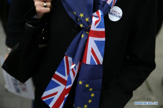 A demonstrator wearing a scarf made of UK and EU flags is seen in London, Britain on March 29, 2017. Britain will trigger its exit from the European Union on Wednesday, nine months after the country voted to leave the European Union. (Xinhua/Tim Ireland) A demonstrator wearing a scarf made of UK and EU flags is seen in London, Britain on March 29, 2017. Britain will trigger its exit from the European Union on Wednesday, nine months after the country voted to leave the European Union. (Xinhua/Tim Ireland)