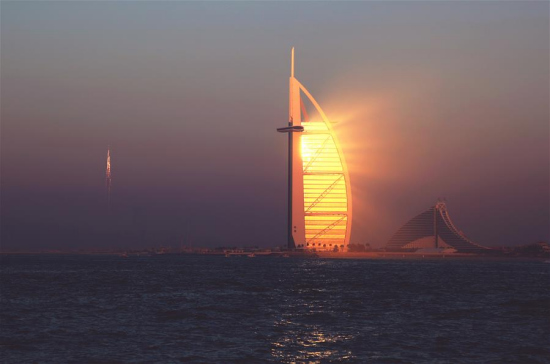 The hotel Burj Al-Arab is seen during sunset in Dubai, the United Arab Emirates (UAE), Dec. 30, 2016. The UAE, located at the intersection of the Belt and Road Initiative, is an important partner for China to promote the Belt and Road Initiative. (Xinhua/Li Zhen) The hotel Burj Al-Arab is seen during sunset in Dubai, the United Arab Emirates (UAE), Dec. 30, 2016. The UAE, located at the intersection of the Belt and Road Initiative, is an important partner for China to promote the Belt and Road Initiative. (Xinhua/Li Zhen)