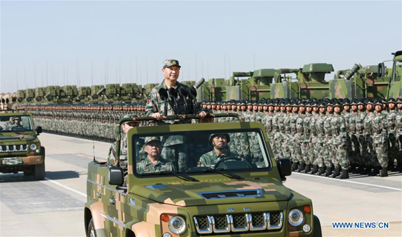 Chinese President Xi Jinping, also general secretary of the Communist Party of China (CPC) Central Committee and chairman of the Central Military Commission, reviews the armed forces as part of the commemorations to mark the 90th founding anniversary of the People's Liberation Army (PLA) at Zhurihe military training base in north China's Inner Mongolia Autonomous Region, July 30, 2017.(Xinhua/Li Gang)