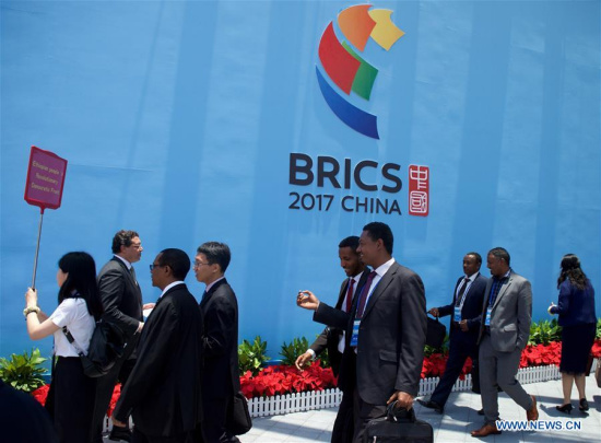 Guests walk out of the venue of the opening ceremony of the BRICS Political Parties, Think-tanks and Civil Society Organizations Forum in Fuzhou, capital of southeast China's Fujian Province, June 11, 2017. The 9th BRICS Summit will be held in Xiamen on Sept. 3-5. (Xinhua/Jiang Kehong) Guests walk out of the venue of the opening ceremony of the BRICS Political Parties, Think-tanks and Civil Society Organizations Forum in Fuzhou, capital of southeast China's Fujian Province, June 11, 2017. The 9th BRICS Summit will be held in Xiamen on Sept. 3-5. (Xinhua/Jiang Kehong)