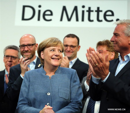 German sitting Chancellor Angela Merkel (L, Front) is applauded after the preliminary exit poll at the Christian Democratic Union (CDU) party's headquarters in Berlin, Germany, on Sept. 24, 2017. (Xinhua/Luo Huanhuan) German sitting Chancellor Angela Merkel (L, Front) is applauded after the preliminary exit poll at the Christian Democratic Union (CDU) party's headquarters in Berlin, Germany, on Sept. 24, 2017. (Xinhua/Luo Huanhuan)